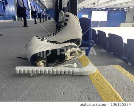 figure skates at an ice rink figure skates at an ice rink 136155884