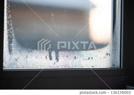 Condensation Builds up on Window Pane, Indicating Poor Ventilation in Home Condensation Builds up on Window Pane, Indicating Poor Ventilation in Home 136156003