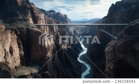 Breathtaking aerial view capturing the mike o'callaghanpat tillman memorial bridge spanning black canyon, with the colorado river winding below under a cloudy sky 136156541