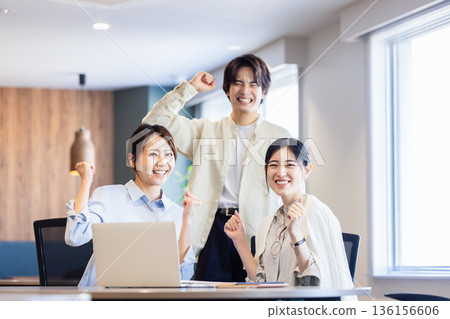 Business person who makes a guts pose Business person who makes a guts pose 136156606