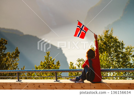 Tourist enjoy fjord view on Stegastein viewpoint Norway Tourist enjoy fjord view on Stegastein viewpoint Norway 136156634