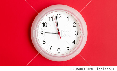clock on wall showing nine hours 136156723