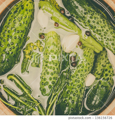 Making pickled cucumbers in clay jar Making pickled cucumbers in clay jar 136156726