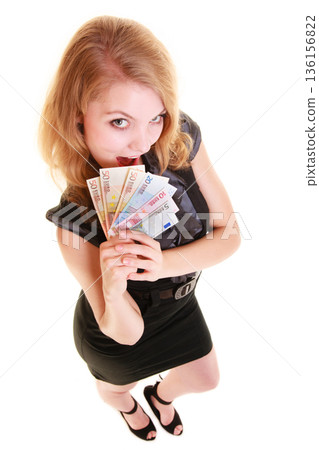 Economy finance. Woman holds euro currency money. Economy finance. Woman holds euro currency money. 136156822