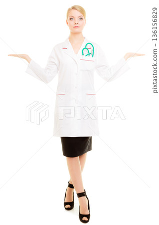 Woman doctor in lab coat with stethoscope. Medical 136156829