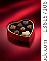 Heart shaped box filled with chocolates, a sweet Valentine's Day gift representing love and romance 136157106