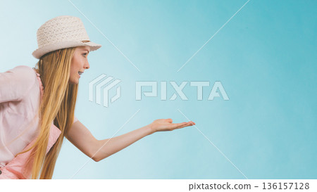 Summer woman holding copy space Summer woman holding copy space 136157128