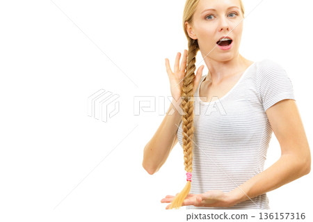 Blonde young woman with braid hair 136157316
