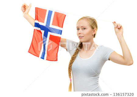 Young woman with norwegian flag 136157320