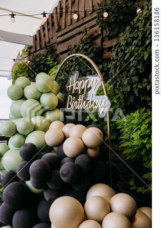 Happy Birthday neon sign with green balloon arch, outdoor party decor Happy Birthday neon sign with green balloon arch, outdoor party decor 136158186