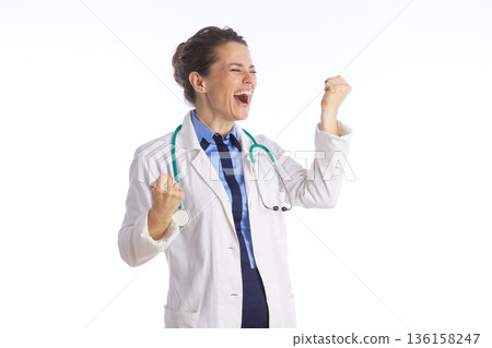 Enthusiastic Female Physician Celebrating Victory 136158247