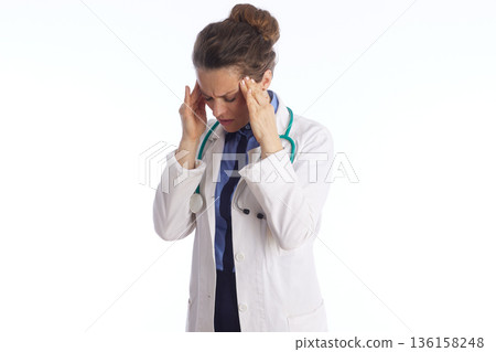 Overworked Healthcare Professional with Migraine Overworked Healthcare Professional with Migraine 136158248
