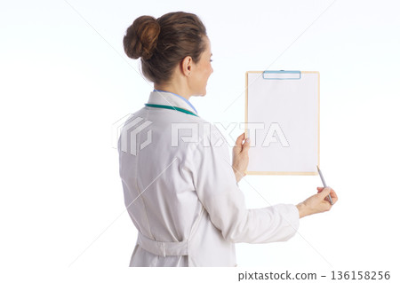 Doctor Explaining Medical Results on Clipboard Doctor Explaining Medical Results on Clipboard 136158256