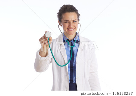 Female Doctor Holding Stethoscope for Heart Exam 136158257