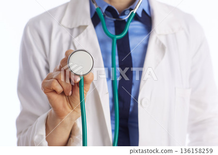 Close Up of Doctor Holding Stethoscope Diaphragm Close Up of Doctor Holding Stethoscope Diaphragm 136158259