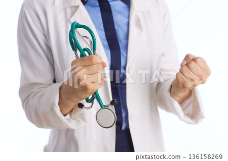 Determined Medical Professional with Clenched Fist Determined Medical Professional with Clenched Fist 136158269