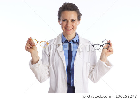 Optometrist Offering a Choice of Stylish Eyeglasses Optometrist Offering a Choice of Stylish Eyeglasses 136158278