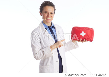 Doctor Pointing to Red First Aid Kit for Safety Doctor Pointing to Red First Aid Kit for Safety 136158284