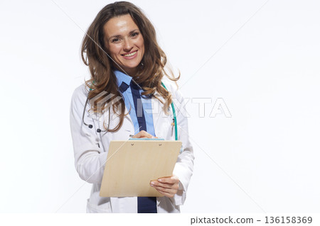 Confident Doctor with Clipboard Portrait 136158369