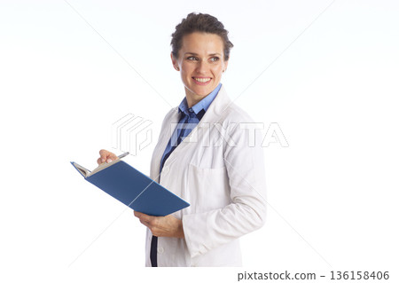 Healthcare Professional with Clipboard and Patient Records Healthcare Professional with Clipboard and Patient Records 136158406