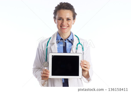Smiling Physician with Green Stethoscope and Tablet Smiling Physician with Green Stethoscope and Tablet 136158411