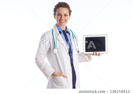 Confident Female Physician Holding Digital Tablet Confident Female Physician Holding Digital Tablet 136158412