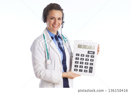 Medical Professional with Calculator for Billing and Insurance 136158416