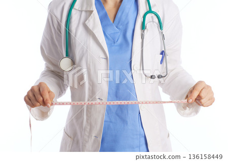 Healthcare Professional Holding Measuring Tape 136158449