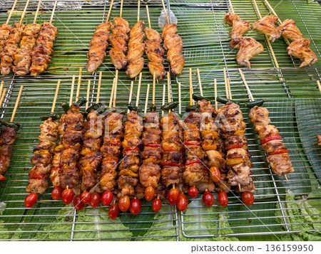 Asian street food grilled chicken skewers on banana leaves Asian street food grilled chicken skewers on banana leaves 136159950