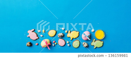 holiday preparation Multi colors Easter eggs with cookies on colored background . Pastel color Easter eggs. holiday concept with copy space holiday preparation Multi colors Easter eggs with cookies on colored background . Pastel color Easter eggs. holiday concept with copy space 136159981