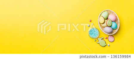 holiday preparation Multi colors Easter eggs with cookies on colored background . Pastel color Easter eggs. holiday concept with copy space holiday preparation Multi colors Easter eggs with cookies on colored background . Pastel color Easter eggs. holiday concept with copy space 136159984