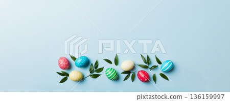 Colorful Easter eggs with spring flower leaf isolated over white background. Colored Egg Holiday border Colorful Easter eggs with spring flower leaf isolated over white background. Colored Egg Holiday border 136159997