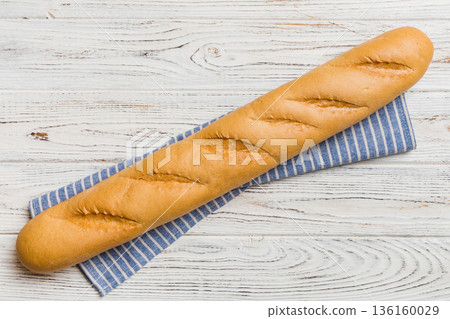 fresh crunchy french baguette on colored table. Top view Bakery products fresh crunchy french baguette on colored table. Top view Bakery products 136160029