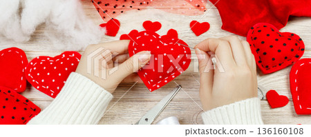Red handmade heart-shaped soft toy, Valentine day, romantic relationship, healthy lifestyle, beautiful present, love and health care concept. holiday decorate valentine day Red handmade heart-shaped soft toy, Valentine day, romantic relationship, healthy lifestyle, beautiful present, love and health care concept. holiday decorate valentine day 136160108