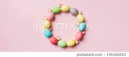 round frame Multi colors Easter eggs on colored background . Pastel color Easter eggs holiday concept with empty space for you design 136160201