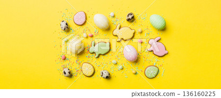 holiday preparation Multi colors Easter eggs with cookies on colored background . Pastel color Easter eggs. holiday concept with copy space holiday preparation Multi colors Easter eggs with cookies on colored background . Pastel color Easter eggs. holiday concept with copy space 136160225