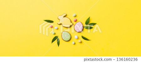 holiday preparation Multi colors Easter eggs with cookies on colored background . Pastel color Easter eggs. holiday concept with copy space 136160236