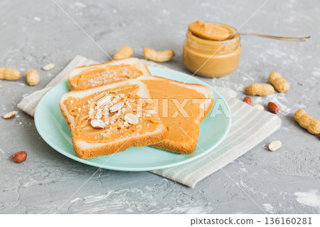 Peanut butter sandwiches or toasts on light table background.Breakfast. Vegetarian food. American cuisine top view vith copy space Peanut butter sandwiches or toasts on light table background.Breakfast. Vegetarian food. American cuisine top view vith copy space 136160281
