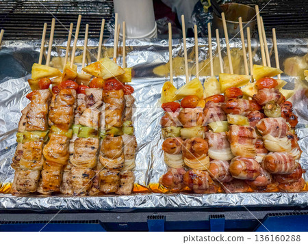 Asian grilled skewers with meat bacon and pineapple Asian grilled skewers with meat bacon and pineapple 136160288
