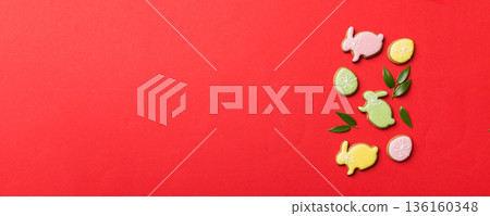 holiday preparation Multi colors Easter eggs with cookies on colored background . Pastel color Easter eggs. holiday concept with copy space 136160348