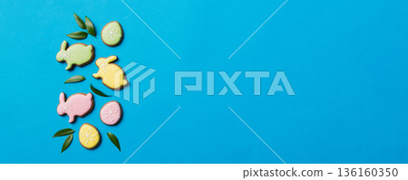 holiday preparation Multi colors Easter eggs with cookies on colored background . Pastel color Easter eggs. holiday concept with copy space holiday preparation Multi colors Easter eggs with cookies on colored background . Pastel color Easter eggs. holiday concept with copy space 136160350