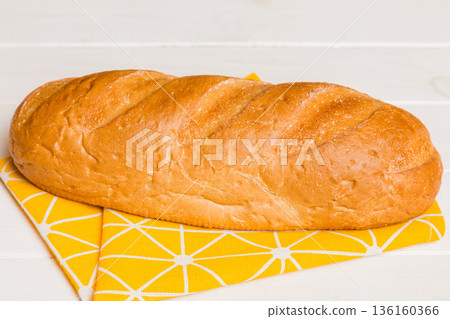 Fresh homemade crisp bread on napkin, top view. Healthy unleavened bread. French bread. Top view Bakery products Fresh homemade crisp bread on napkin, top view. Healthy unleavened bread. French bread. Top view Bakery products 136160366