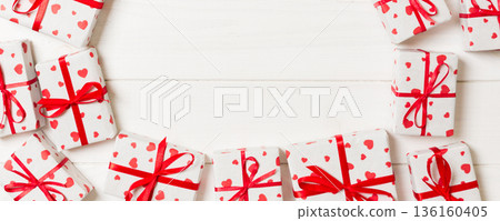 Frame of many Colorful gift boxes with red bow and heart blank copy space top view, Valentine or other holidays celebrations concept Frame of many Colorful gift boxes with red bow and heart blank copy space top view, Valentine or other holidays celebrations concept 136160405