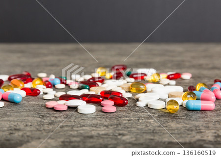 Collection Of Various Medical Tablets And Pills. Assorted pharmaceutical medicine pills, tablets and capsules on table background. Heap of assorted various medicine tablets. Health care 136160519