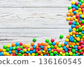 Mixed collection of colorful candy, on colored background. Flat lay, top view. frame of colorful chocolate coated candy 136160545