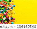 Mixed collection of colorful candy, on colored background. Flat lay, top view. frame of colorful chocolate coated candy 136160548