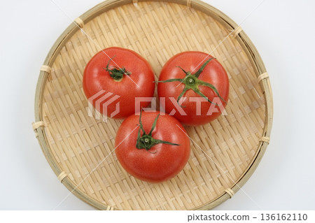 A simple composition of three large tomatoes A simple composition of three large tomatoes 136162110