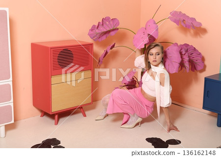 Stylish space decorated with antique furniture and vibrant flowers Stylish space decorated with antique furniture and vibrant flowers 136162148