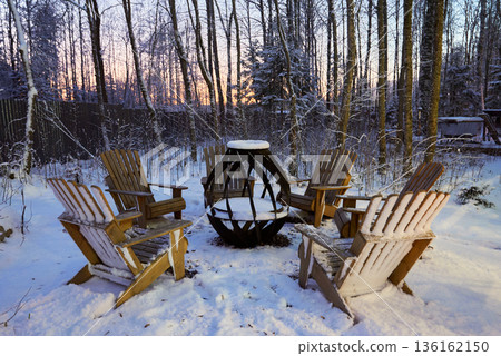 Chairs by fire during twilight foster intimate winter moments 136162150