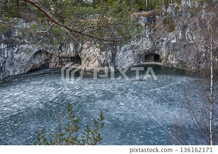 Ruskeala mountain park marble canyon lake with icy water in a nature park landscape for travel and tourism 136162171